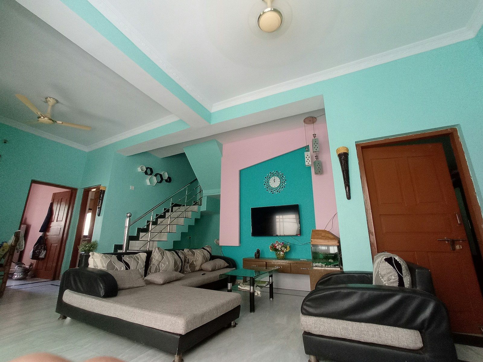 a living room with a couch and a tv